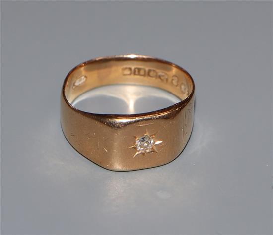 A gentlemens 18ct gold wedding ring, gypsy-set with a single diamond, size R.